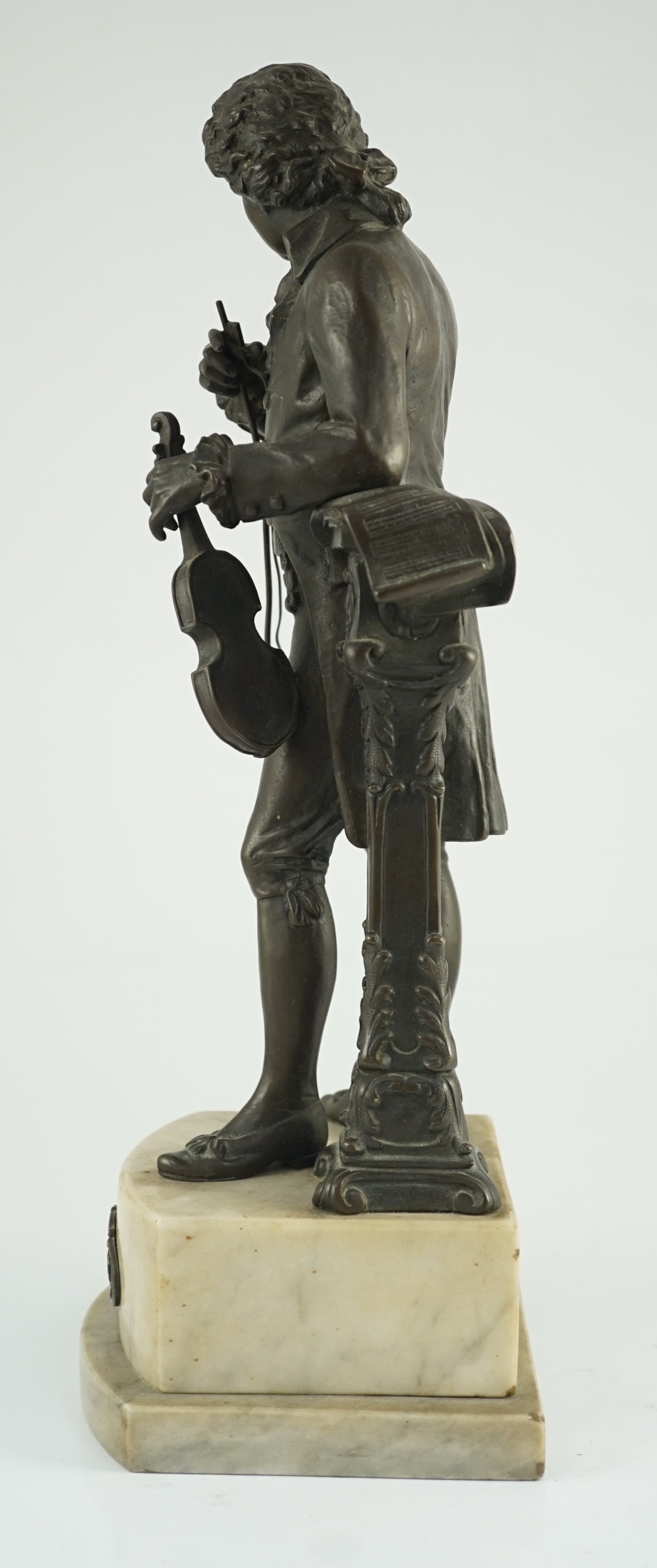 Carl Brose (German, 1880-). An early 20th century bronze figure of Mozart holding a violin, 41cm high